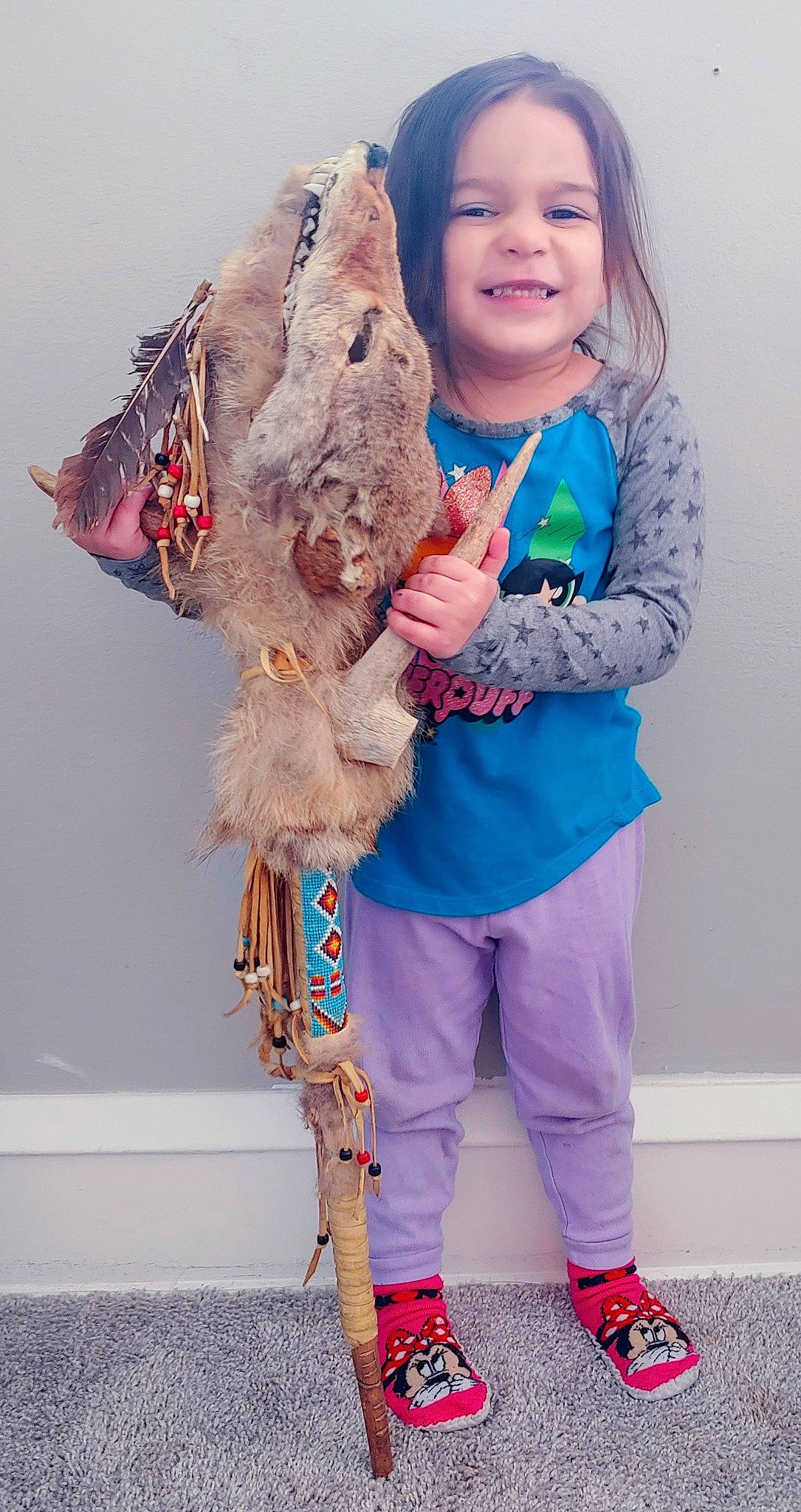 Navi is registered to the contest to win money with this photo: child, electric_blue, fashion_design, fawn, fish, fun, fur, fur_clothing, gesture, happy, joy, outerwear, person, pink, purple, sleeve, smile, standing, stuffed_toy, toddler