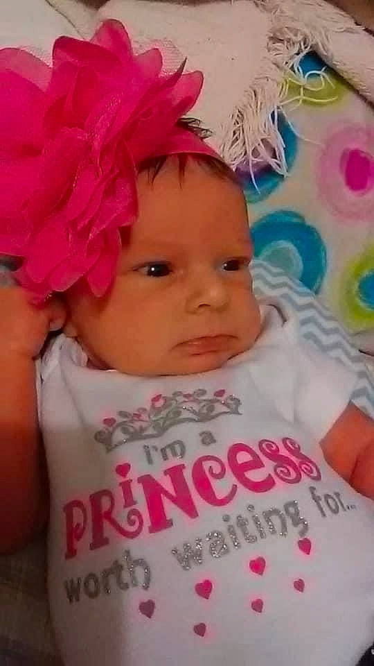 Ava is registered to the contest to win money with this photo: baby, baby_toddler_clothing, cap, cheek, child, cool, eye, eyebrow, eyelash, forehead, happy, headband, headpiece, headwear, iris, lip, magenta, person, petal, pink