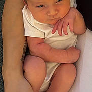 Ava is registered to the contest to win money with this photo: baby, infant, newborn, arm, hand, skin, clothing, white, person, human, face, legs, feet, fingers, resting, holding, cozy, cute, portrait, closeup