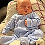 Hudson joined the competition — help win amazing prizes! baby, sleeping, infant, pajamas, striped_clothing, blanket, plaid, soft_texture, peaceful, cute, child, newborn, portrait, relaxing, indoor, cozy, person, resting, small_hands, closed_eyes