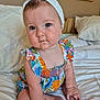 baby, child, infant, headband, colorful_dress, sitting, bed, pillow, indoor, portrait, cute, hands, feet, skin, face, eyes, photography, room, decor, framed_photos