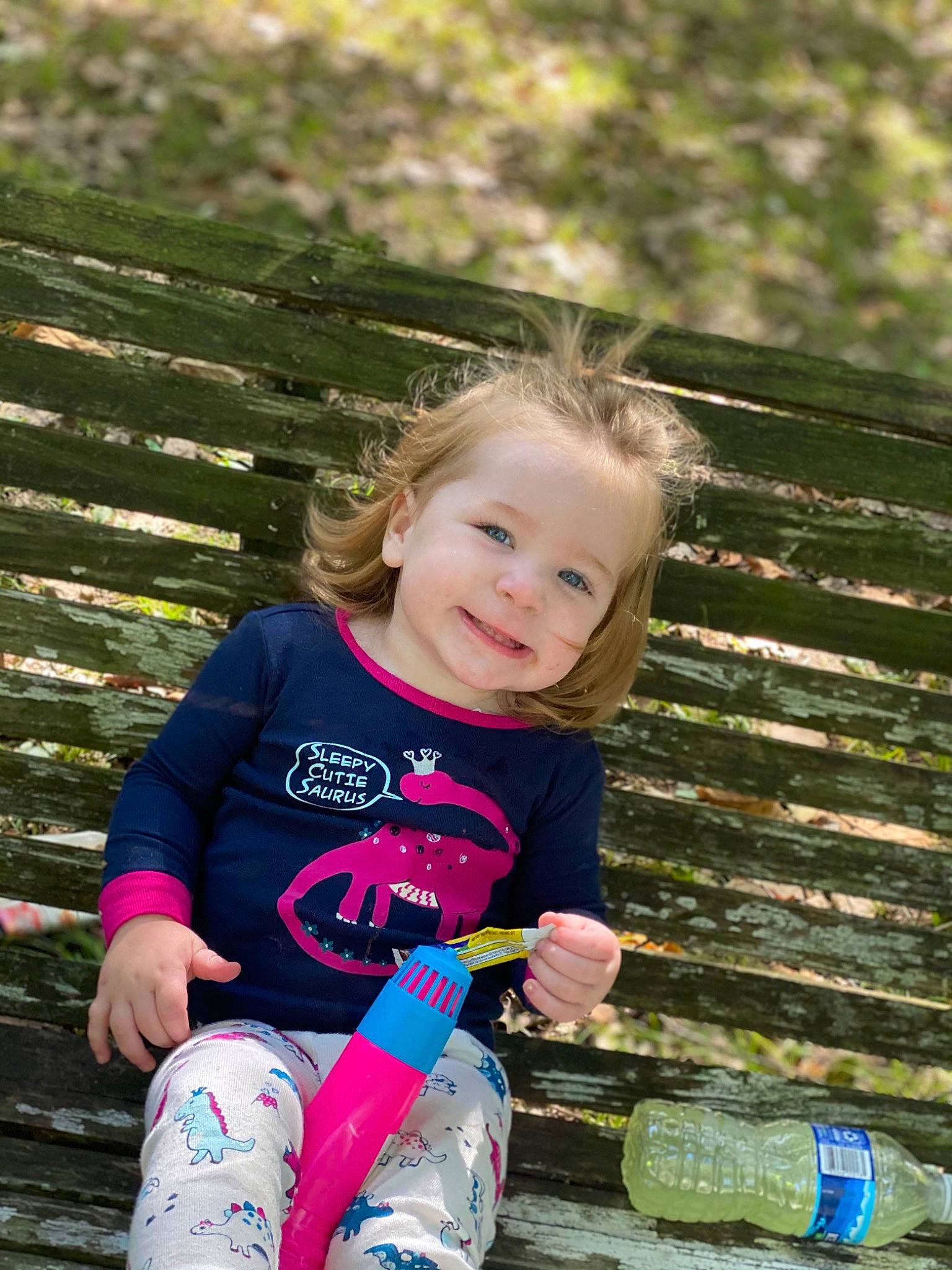 Indie is registered to the contest to win money with this photo: child, eye, family, grass, green, happy, joy, leisure, people, person, photography, pink, play, recreation, sitting, smile, style, summer, toddler, tree