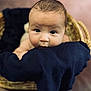 baby, infant, basket, blanket, cute, face, portrait, child, newborn, closeup, soft_focus, indoors, skin, expression, curious, resting, wrapped, person, head, young