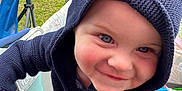 Banks joined the competition — help win amazing prizes! baby, bonnet, cap, clothing, coat, face, grass, hat, head, hood, hoodie, jacket, knitwear, outdoors, person, photography, plant, portrait, sweater, sweatshirt