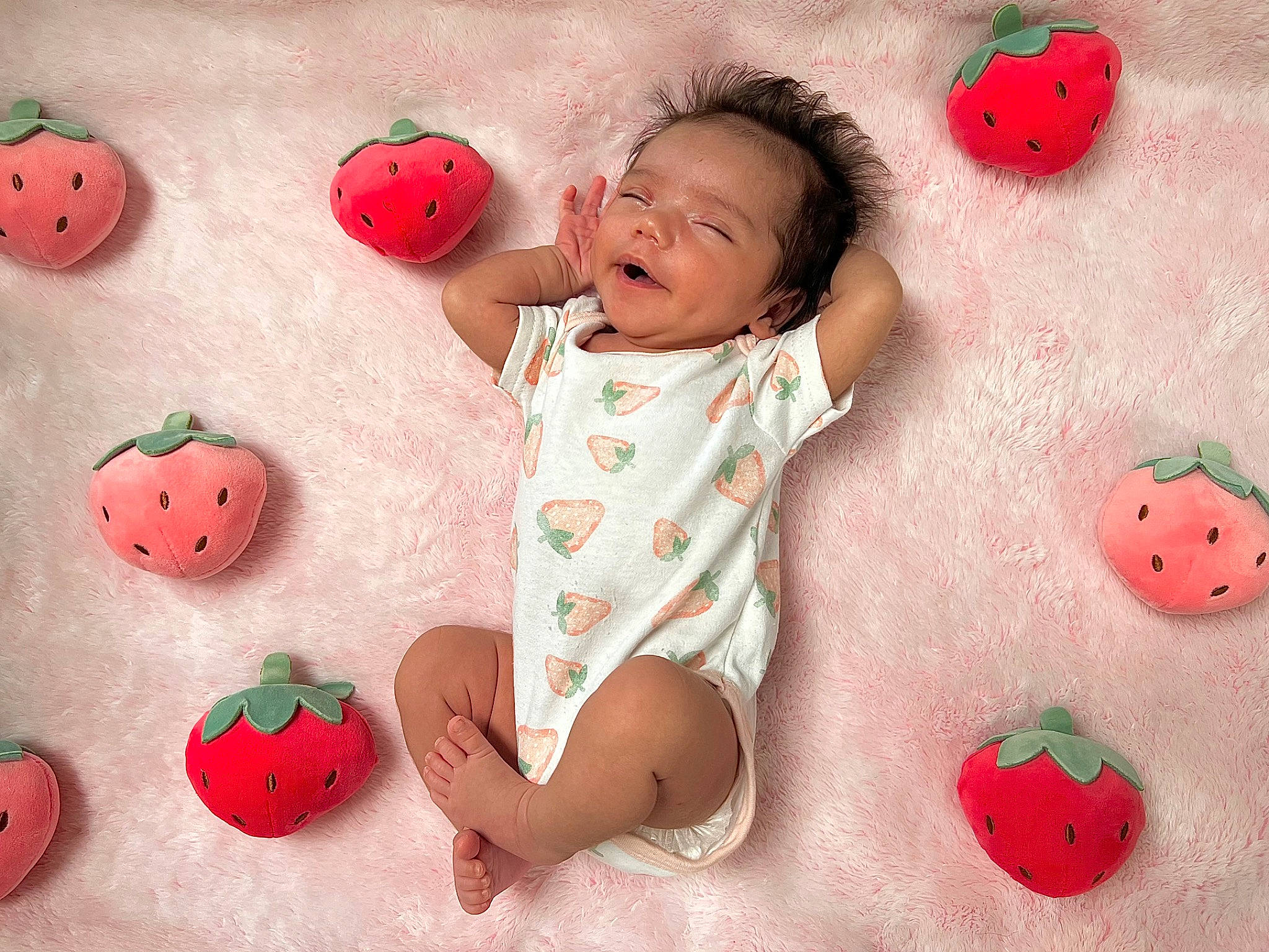 Jem is registered to the contest to win money with this photo: baby, baby_toddler_clothing, child, facial_expression, finger, happy, leaf, natural_foods, orange, pattern, people, people_in_nature, person, photograph, pink, product, red, skin, textile, toddler