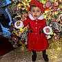 Tenessy a rejoint le concours — aidez-le/la à gagner de superbes lots ! child, toddler, christmas_tree, holiday, red_clothing, red_hat, decorations, lights, indoors, floor, festive, candy_cane, ornaments, black_shoes, marble_floor, smiling, person, celebration, winter_clothing, cute