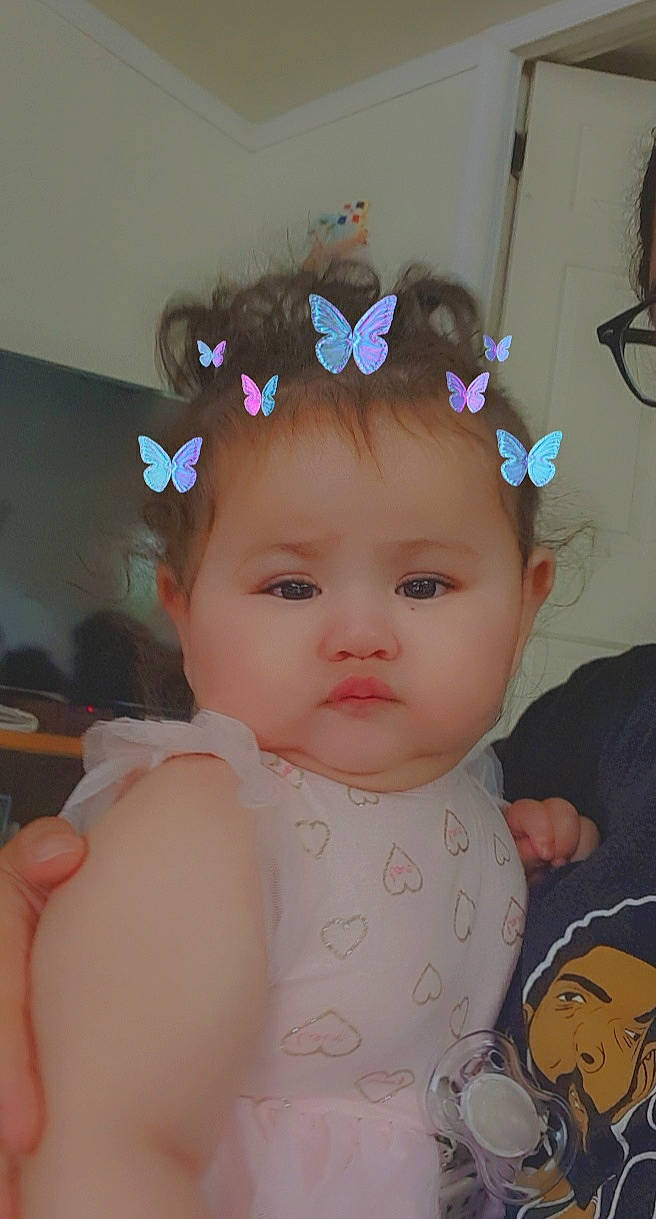 Noreen is registered to the contest to win money with this photo: baby, cheek, child, ear, fashion_accessory, hair_accessory, head, headband, headgear, headpiece, iris, person, pink, skin, toddler