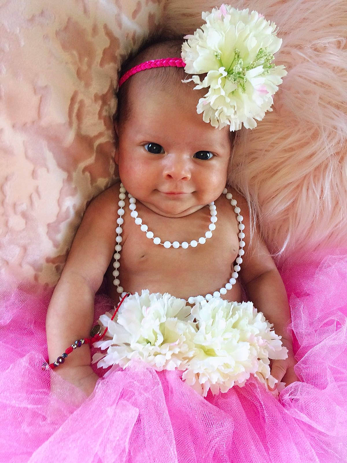 Kamilla is registered to the contest to win money with this photo: bridal_clothing, bride, cheek, child, flower, flower_arranging, flower_bouquet, flower_girl, girl, gown, hair_accessory, happiness, headpiece, infant, joy, person, petal, pink, skin, smile