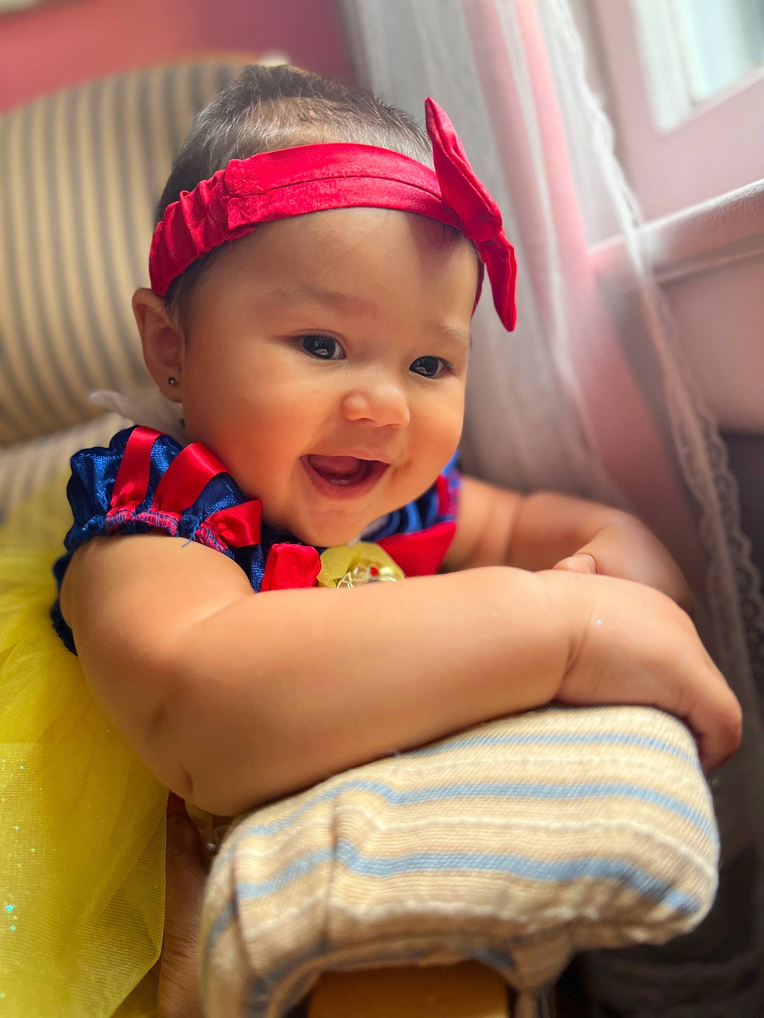 Kaitlyn is registered to the contest to win money with this photo: arm, baby, baby_laughing, baby_toddler_clothing, child, chin, comfort, eye, fun, happy, headwear, iris, leisure, magenta, mouth, party, person, pink, skin, smile