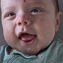 baby, close_up, face, happy, smiling, infant, child, blue_eyes, green_clothing, onesie, mouth_open, tongue, skin, head, forehead, mark, texture, fabric, pattern, portrait