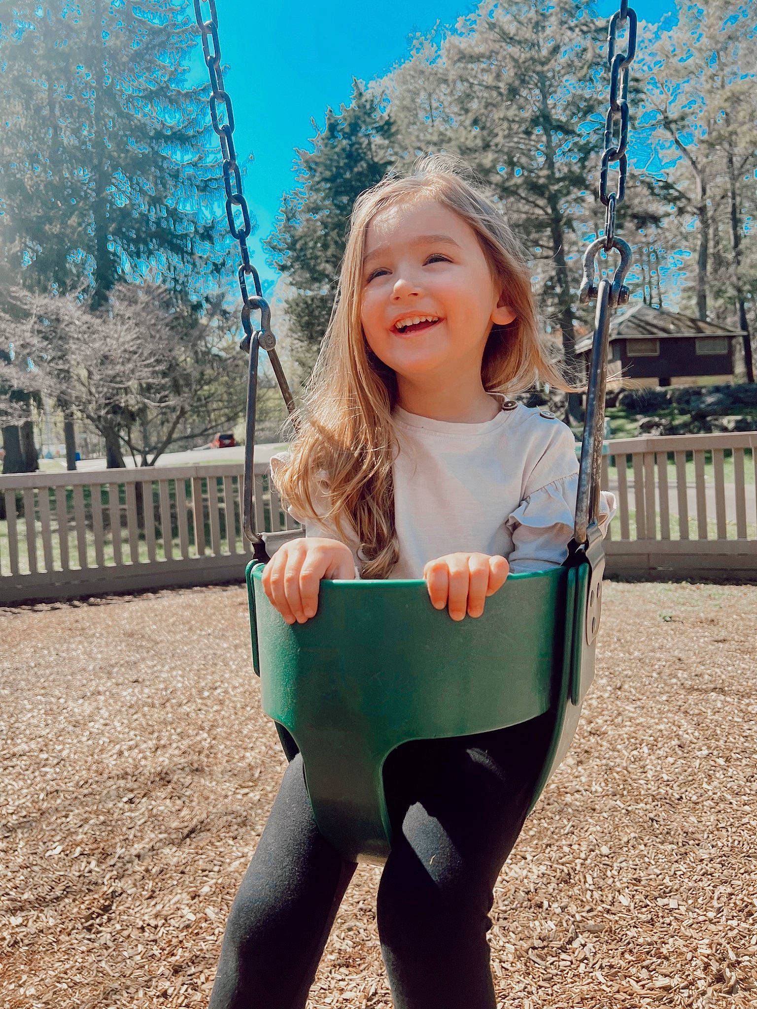 Kayden is registered to the contest to win money with this photo: active_pants, eye, face, facial_expression, grass, hair, hairstyle, happy, joy, leaf, leisure, outerwear, people_in_nature, person, plant, sky, sleeve, smile, t_shirt, toddler