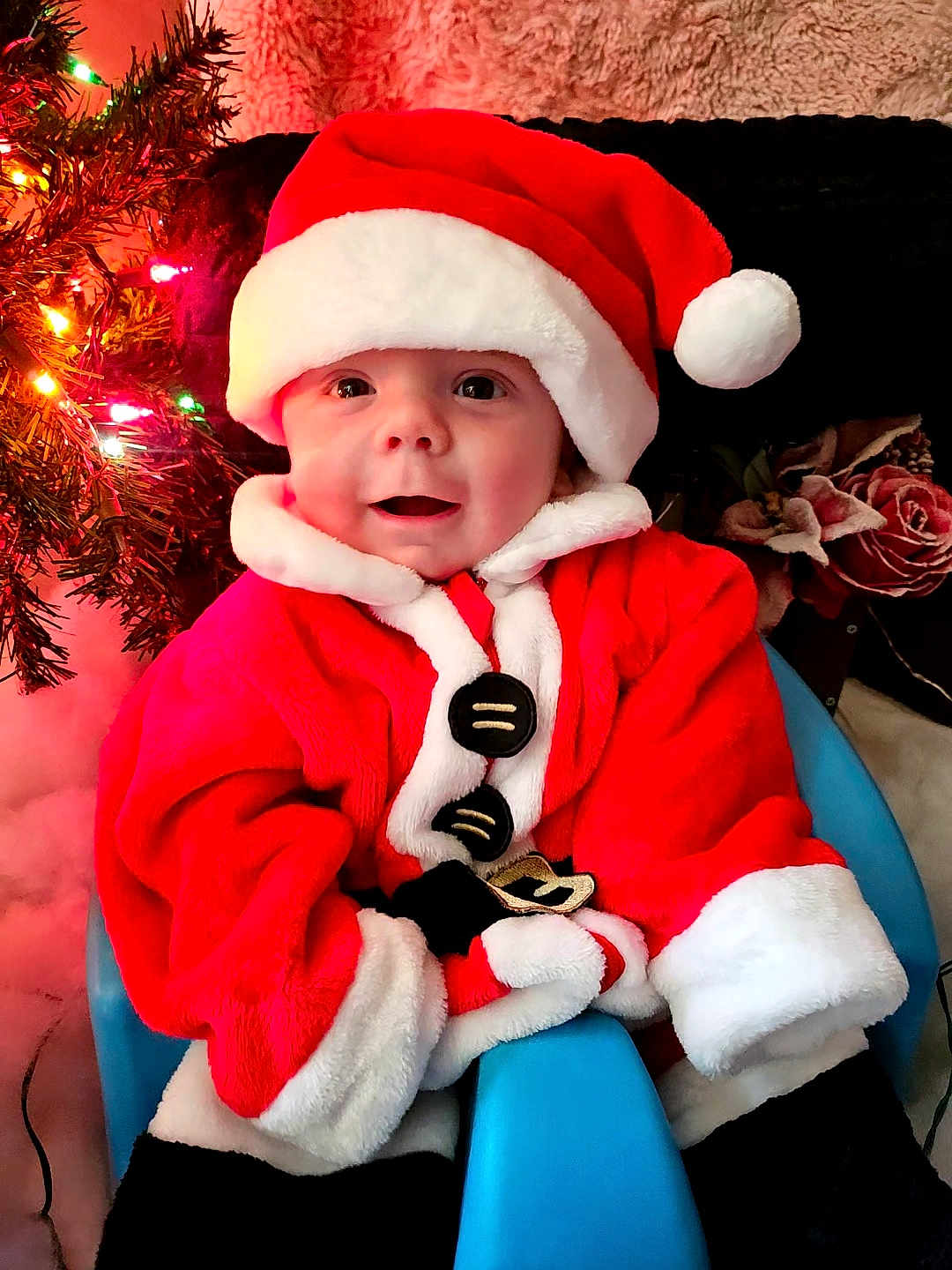 Jacob joined the competition — help win amazing prizes! baby, child, santa_claus, christmas, holiday, festive, red_clothing, hat, smile, face, chair, indoor, decorations, tree, lights, cute, portrait, happy, seasonal, warm