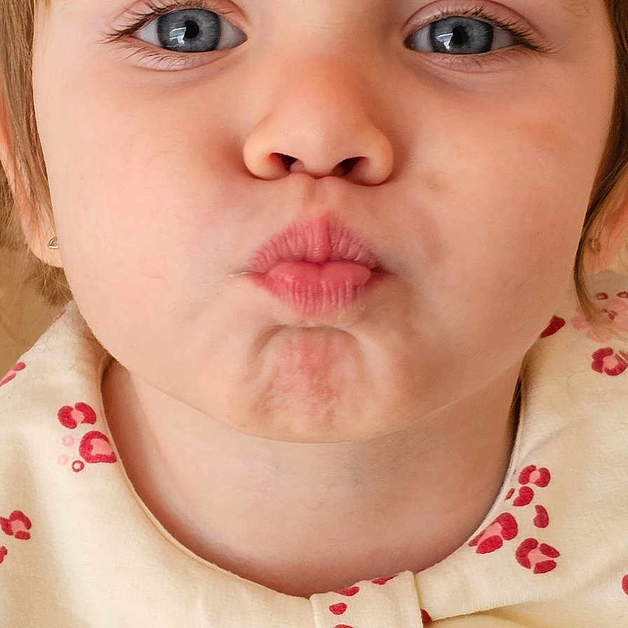 Miruna participe au concours pour gagner de l'argent avec cette photo : adorable, blue_eyes, bow_collar, child, close_up, earring, eyelashes, frontal_face, indoor, mouth, natural_skin, nose, patterned_clothing, playful_expression, portrait, pursed_lips, short_hair, soft_lighting, toddler, young_child