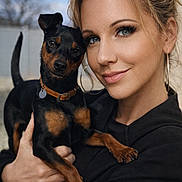 Arielle a rejoint le concours — aidez-le/la à gagner de superbes lots ! animal, black_clothing, collar, companion, cute, dog, earrings, eyes, face, fence, friendly, holding, love, outdoor, pet, portrait, short_hair, small_dog, smile, woman