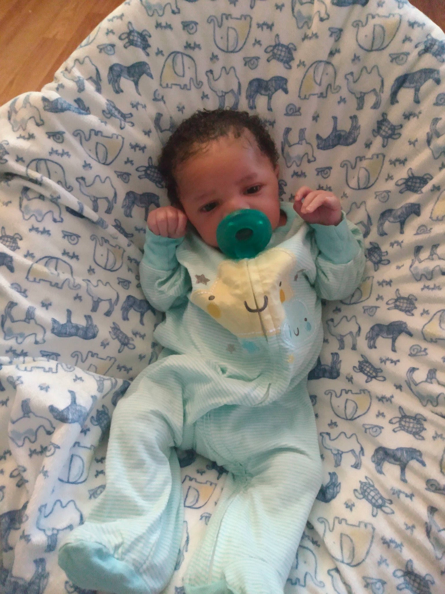 Israel is registered to the contest to win money with this photo: baby, baby_products, baby_toddler_clothing, bedtime, cheek, child, chin, comfort, head, linens, mouth, nose, pattern, person, room, sitting, skin, sleep, sleeve, textile