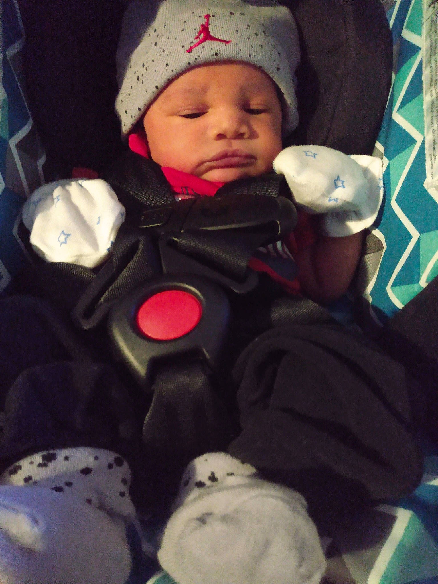 Israel is registered to the contest to win money with this photo: baby, baby_carriage, baby_in_car_seat, baby_products, baby_sleeping, baby_toddler_clothing, cap, car_seat, carmine, cheek, child, comfort, face, head, headgear, headwear, human_body, mouth, person, textile