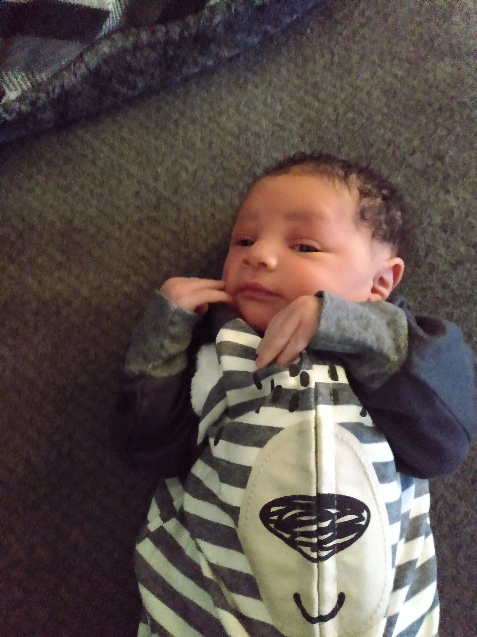 Israel is registered to the contest to win money with this photo: arm, baby_carrier, baby_toddler_clothing, cheek, eye, eyebrow, face, hair, hand, head, human_body, iris, lip, mouth, neck, nose, outerwear, person, skin, sleeve