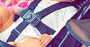 Hazel-Lee is registered to the contest to win money with this photo: baby, stroller, blanket, child, smile, hair, seatbelt, clothing, outdoor, happy, infant, person, portrait, baby_carrier, graco, fabric, hand, head, sitting, cute