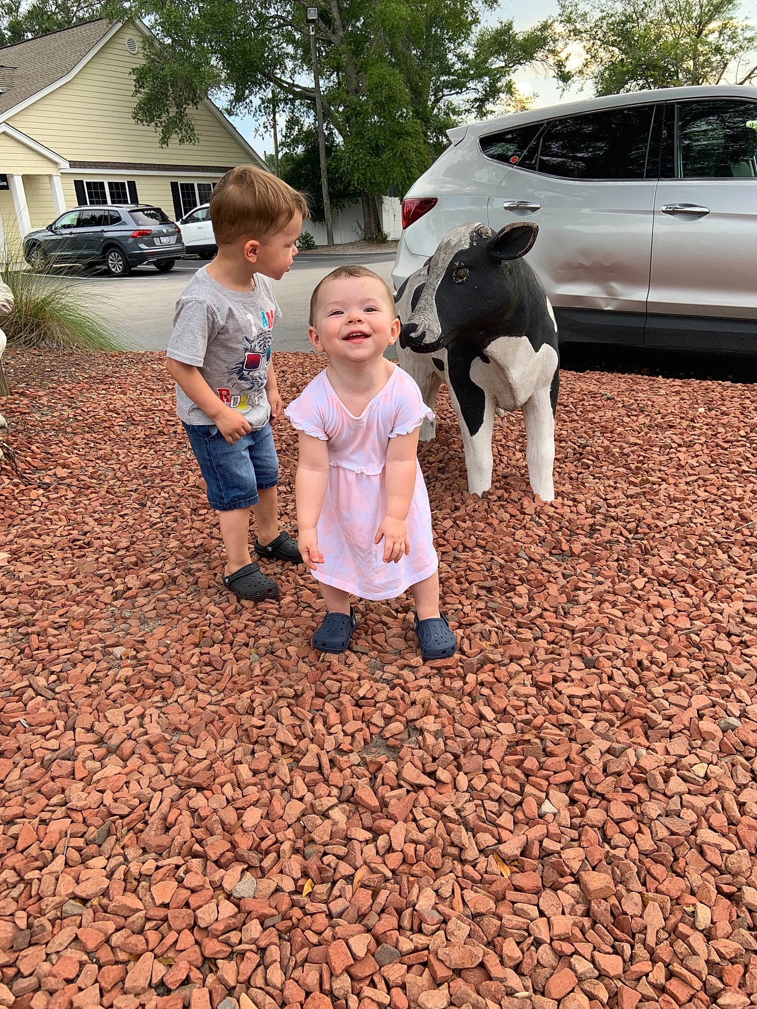 Juliet is registered to the contest to win money with this photo: car, child, family, fawn, flooring, fun, joy, leaf, leg, person, plant, soil, toddler, tourism, vacation, walking