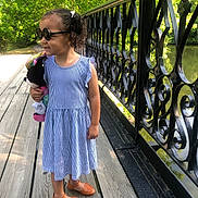 Kamara joined the competition — help win amazing prizes! child, girl, sunglasses, dress, striped, toy, stuffed_animal, bridge, wooden, railing, iron, outdoor, sunlight, trees, nature, smiling, shoes, summer, happy, portrait
