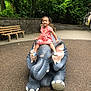 Kamara joined the competition — help win amazing prizes! toddler, child, elephant_statue, playground, pink_dress, smiling, outdoor, trees, benches, concrete, greenery, toy, childrens_play_area, happy, person, cute, fun, summer, daytime, park