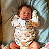 Matthew joined the competition — help win amazing prizes! baby, newborn, sleeping, onesie, patterned_clothing, blanket, socks, pink, blue, cozy, infant, cute, soft, peaceful, child, resting, indoors, portrait, warm, face