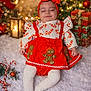 baby, child, christmas, holiday, festive, red_clothing, gingerbread, candy_cane, headband, tights, snow, christmas_tree, presents, lantern, lights, decorations, smiling, cute, indoors, celebration