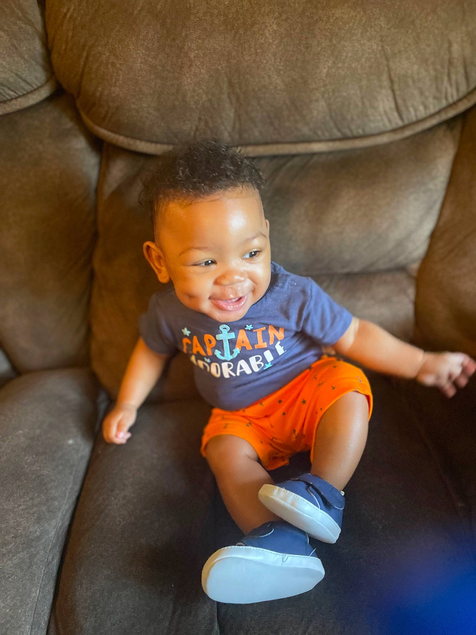 Noel joined the competition — help win amazing prizes! arm, baby, baby_toddler_clothing, comfort, eye, flash_photography, floor, flooring, knee, lap, leg, mammal, mouth, nose, person, skin, sleeve, smile, sneakers, thigh