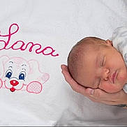 Lana participe au concours pour gagner de l'argent avec cette photo : baby_products, bed, bedtime, blanket, cheek, child, infant, infant_bed, material, nap, nose, pink, product, skin, sleep, smile, textile, toddler