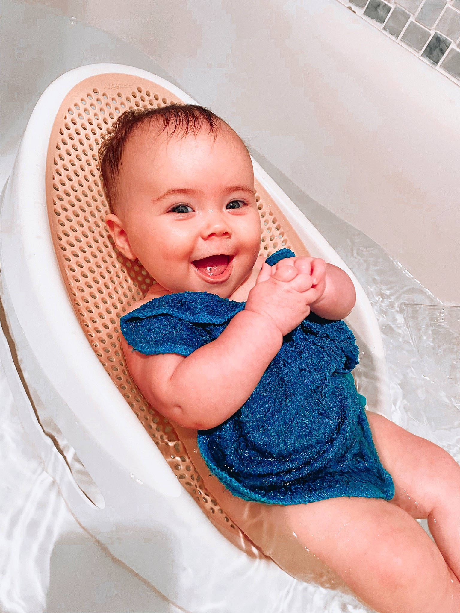 Leighton is registered to the contest to win money with this photo: baby, baby_products, baby_toddler_clothing, bathing, child, comfort, dress, facial_expression, fun, happy, iris, leisure, pattern, person, pink, product, sitting, skin, smile, toddler