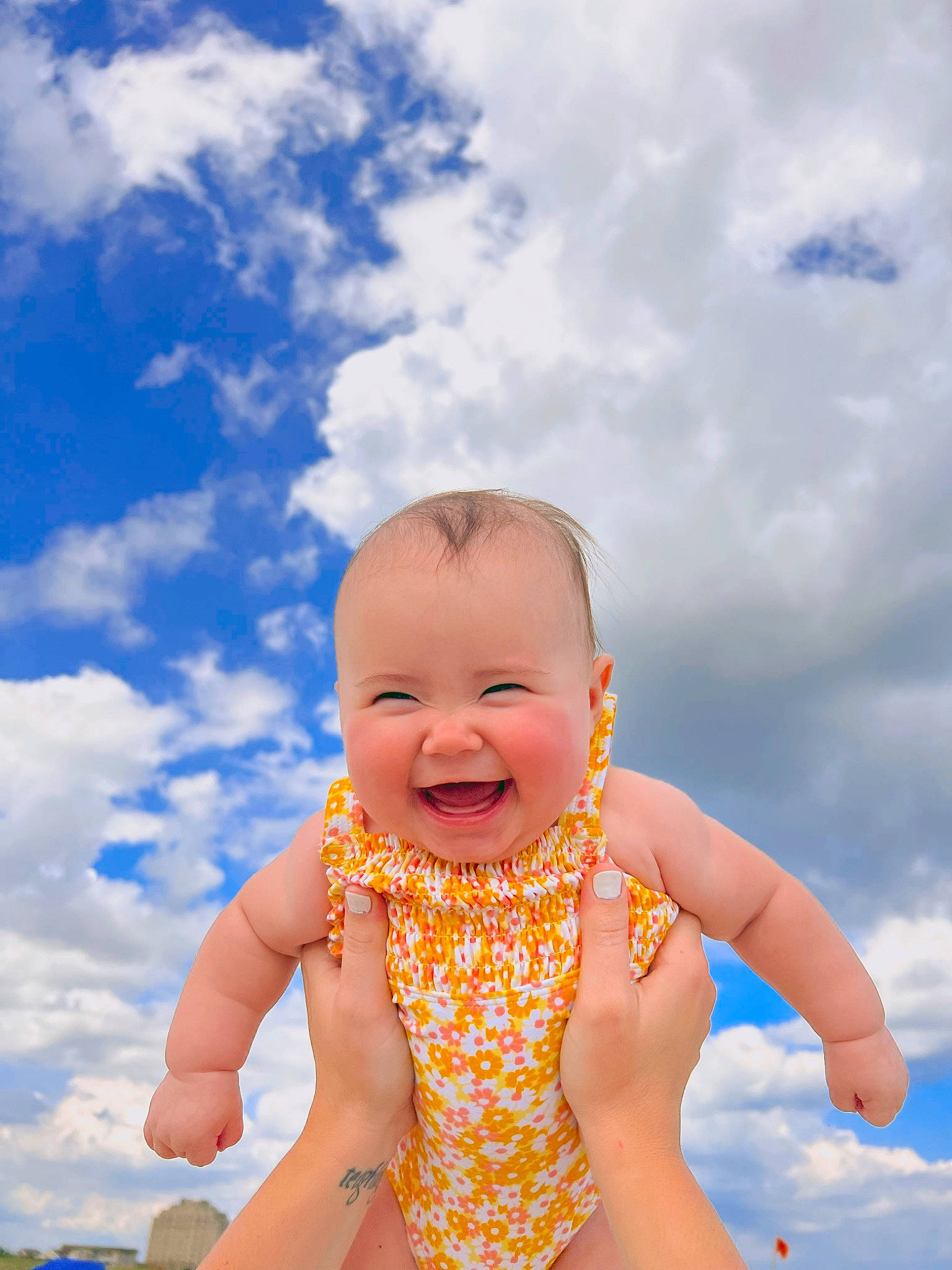 Leighton joined the competition — help win amazing prizes! abdomen, azure, baby, baby_toddler_clothing, blue, cloud, eye, face, gesture, grass, happy, human_body, joy, leisure, people_in_nature, person, playing_with_kids, recreation, sky, smile