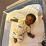 Mj joined the competition — help win amazing prizes! baby, child, infant, playpen, pajamas, dinosaur_pattern, indoor, carpet, blanket, sleepwear, cute, portrait, person, young_child, resting, comfort, soft_surface, curious, lying_down, home