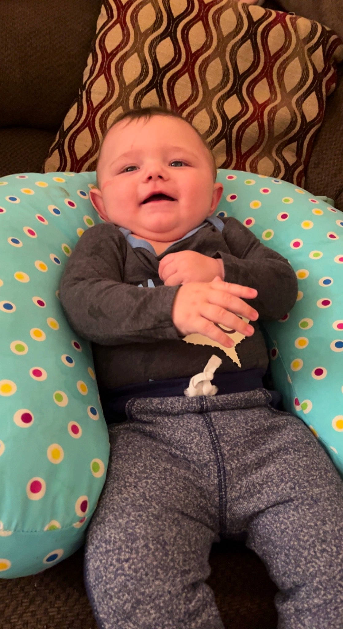 Braxton joined the competition — help win amazing prizes! baby, baby_products, baby_toddler_clothing, chair, cheek, child, comfort, eye, face, facial_expression, head, lap, linens, mouth, pattern, person, sitting, skin, sleeve, smile