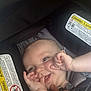 baby, child, car_seat, smile, hand, fingers, face, infant, seatbelt, happiness, cute, closeup, person, safety, young_child, skin, head, expression, car, straps