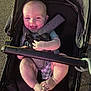 John joined the competition — help win amazing prizes! baby, child, stroller, smile, happy, infant, cute, foot, hand, seatbelt, outdoor, person, legs, clothing, playful, transportation, safety, young, joyful, portrait