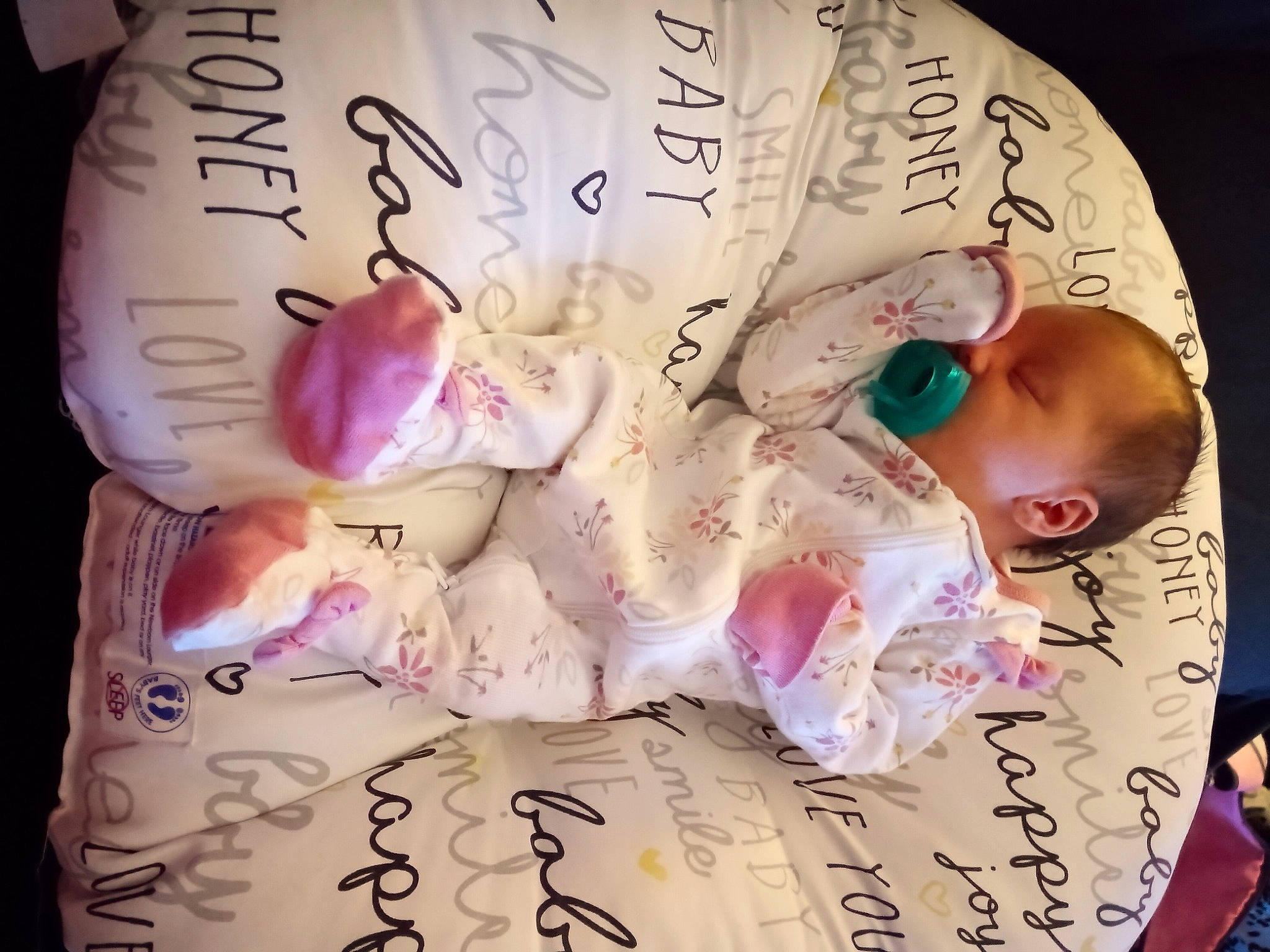 Josephine is registered to the contest to win money with this photo: baby, baby_toddler_clothing, child, comfort_food, flesh, font, handwriting, happy, magenta, material_property, nail, paper, person, petal, pink, plant, sweetness, toddler