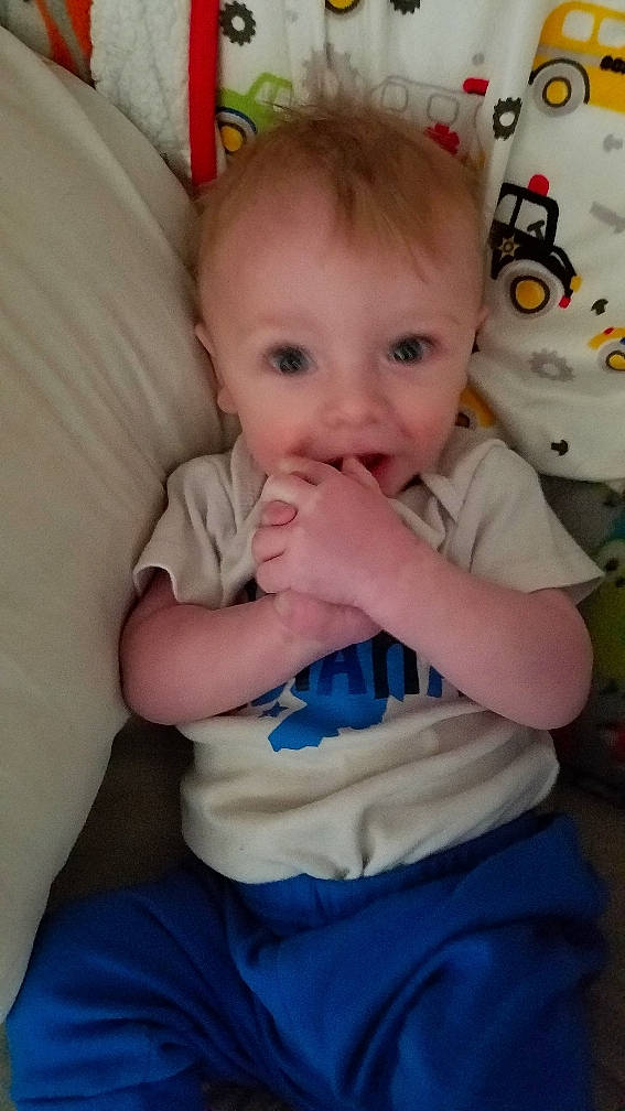 Todd is registered to the contest to win money with this photo: baby, baby_products, cheek, child, eye, face, finger, head, lip, mouth, nose, person, play, product, sitting, skin, smile, thumb, toddler