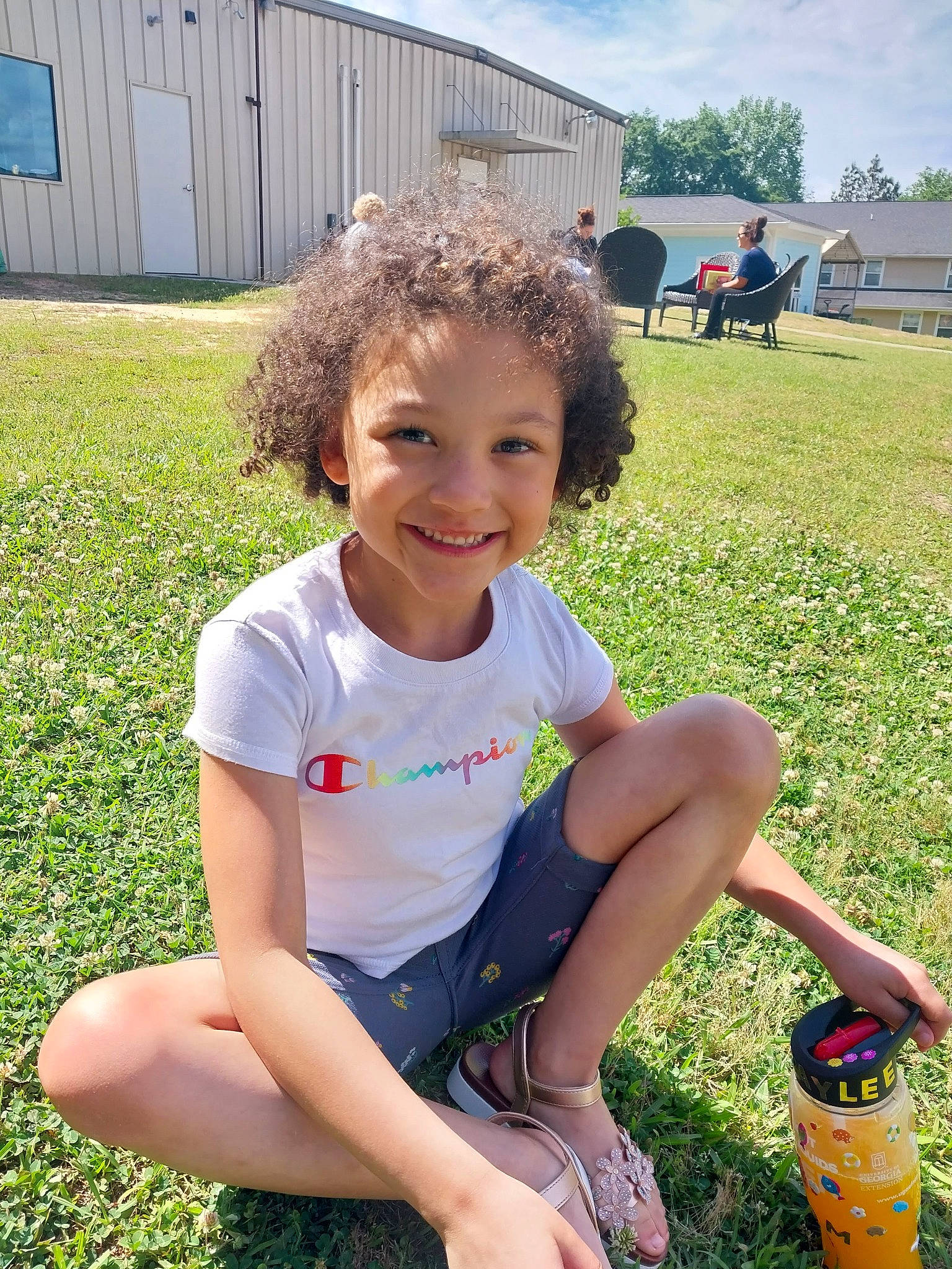 Kaylee joined the competition — help win amazing prizes! child, fun, garden, grass, happy, human_leg, joy, lawn, leisure, people_in_nature, person, plant, recreation, shorts, sitting, sky, smile, summer, t_shirt, thigh