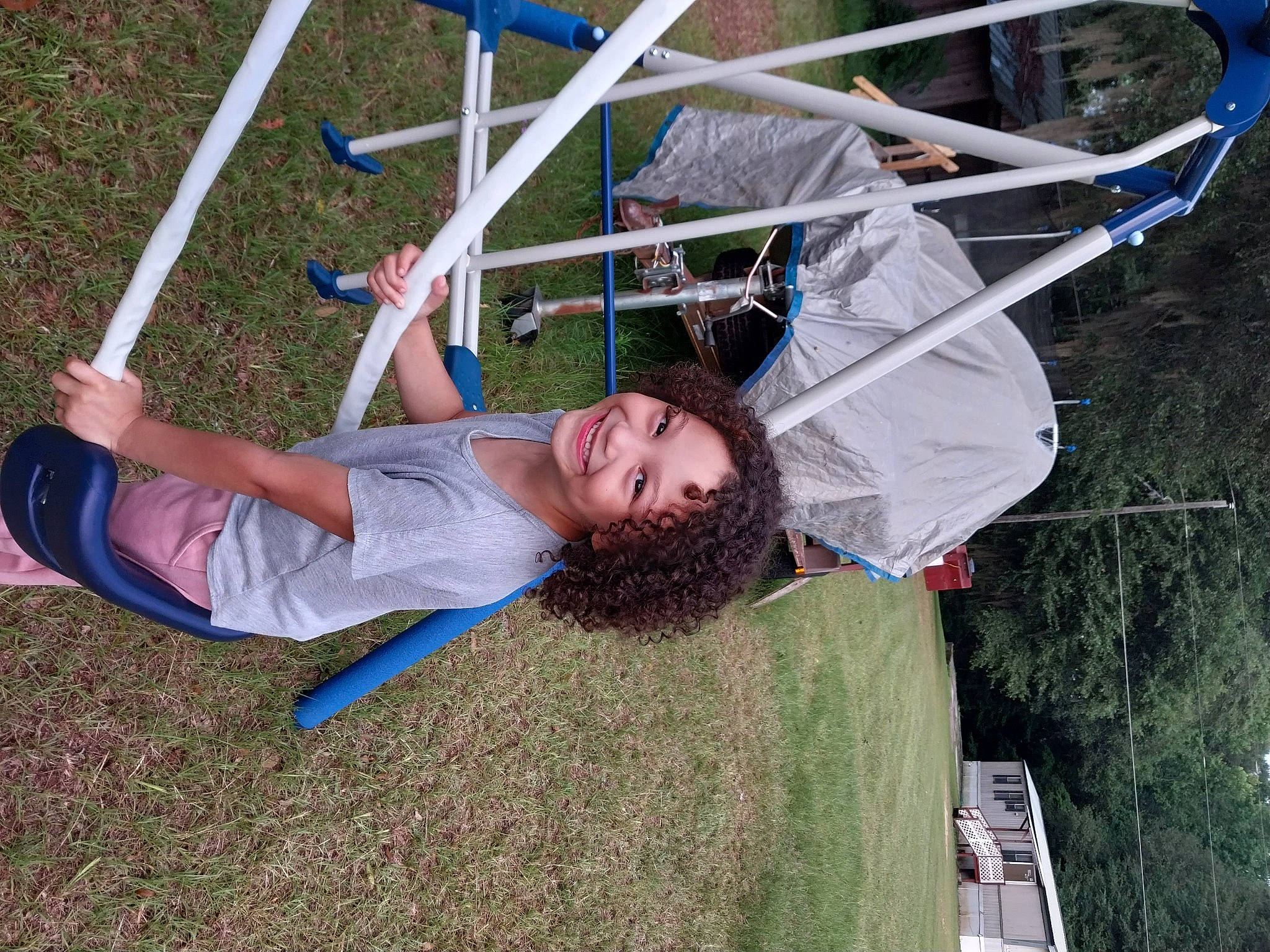 Kaylee is registered to the contest to win money with this photo: electric_blue, event, fun, grass, grassland, hat, human_leg, joy, knee, leisure, person, plant, pole, recreation, shorts, thigh, tree, water