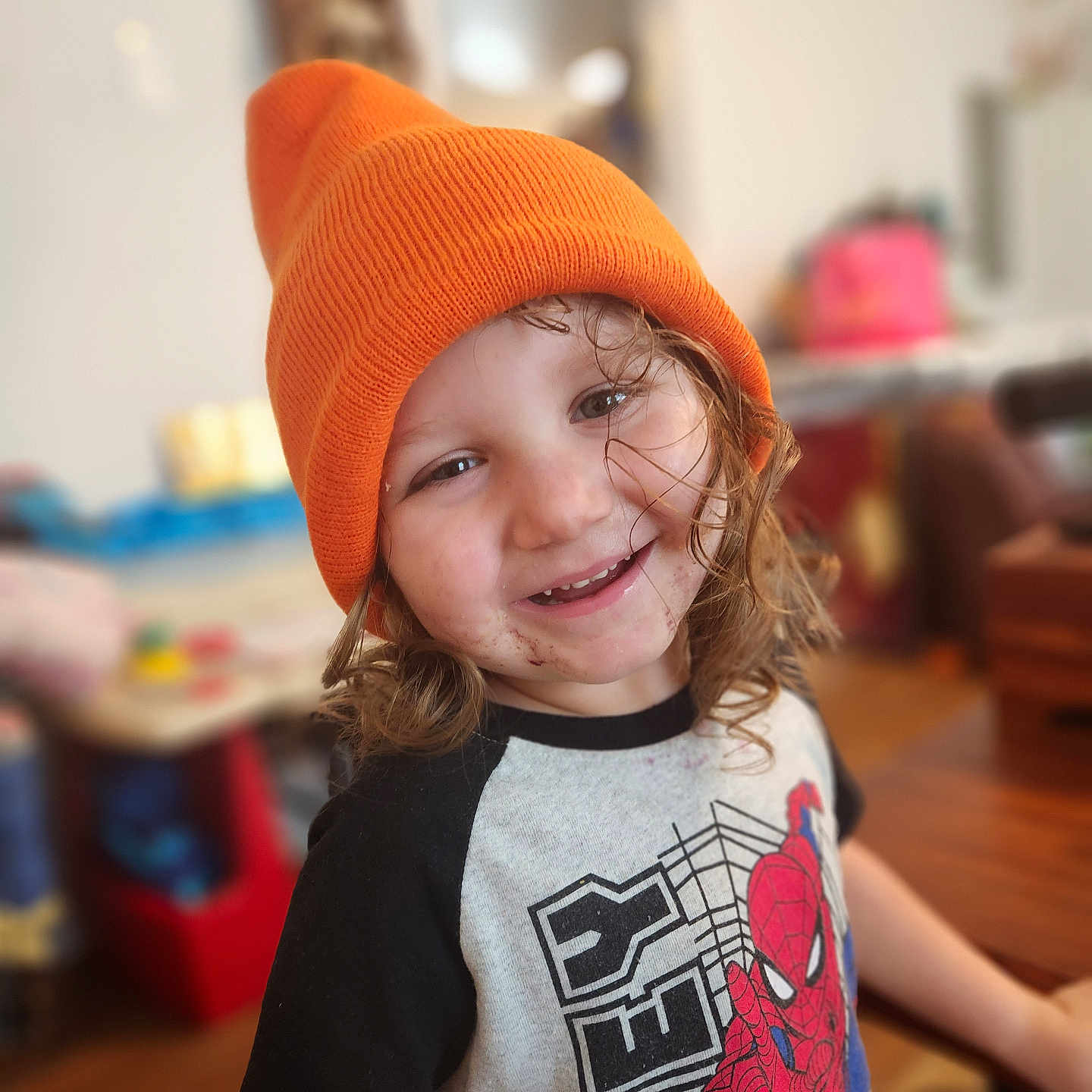 Joshua joined the competition — help win amazing prizes! architecture, beanie, bodypart, bonnet, building, cap, child, clothing, couch, face, female, finger, fleece, furniture, girl, hand, happy, hardwood, hat, head