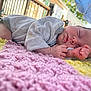 Paisley is registered to the contest to win money with this photo: baby, newborn, sleeping, blanket, knitted, outdoor, soft_light, hand, face, peaceful, infant, cute, skin, clothing, closeup, portrait, resting, head, tiny, cozy