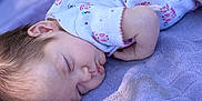 Paisley joined the competition — help win amazing prizes! baby, sleeping, blanket, pajamas, child, infant, face, peaceful, soft_light, purple, cute, resting, young_child, toddler, comfort, portrait, indoors, sleep, cozy, peace