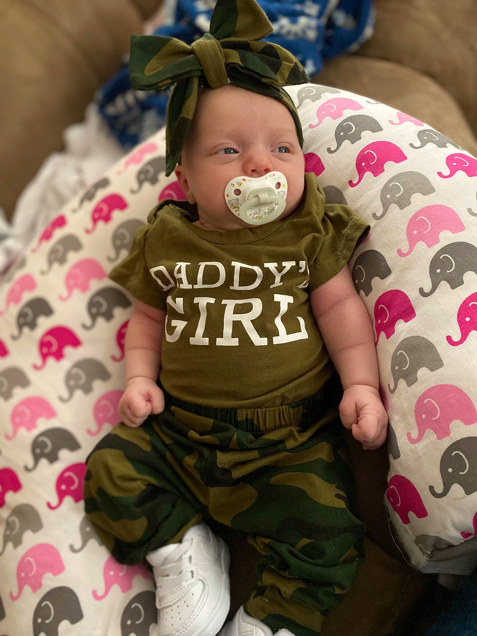Amiah is registered to the contest to win money with this photo: baby, baby_products, baby_toddler_clothing, camouflage, military_camouflage, nightwear, overall, pattern, person, sleeve, sock, toddler