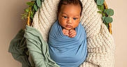 Junior joined the competition — help win amazing prizes! baby, basket, blanket, child, cozy, cute, greenery, hands, head, infant, knit, leaves, newborn, peaceful, photography, portrait, soft, studio, swaddled, wrapped