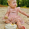 baby, birthday, cake, celebration, child, cute, food, forest, frosting, fun, happy, headband, messy, nature, outdoor, pink_dress, sand, sitting, smile, sprinkles