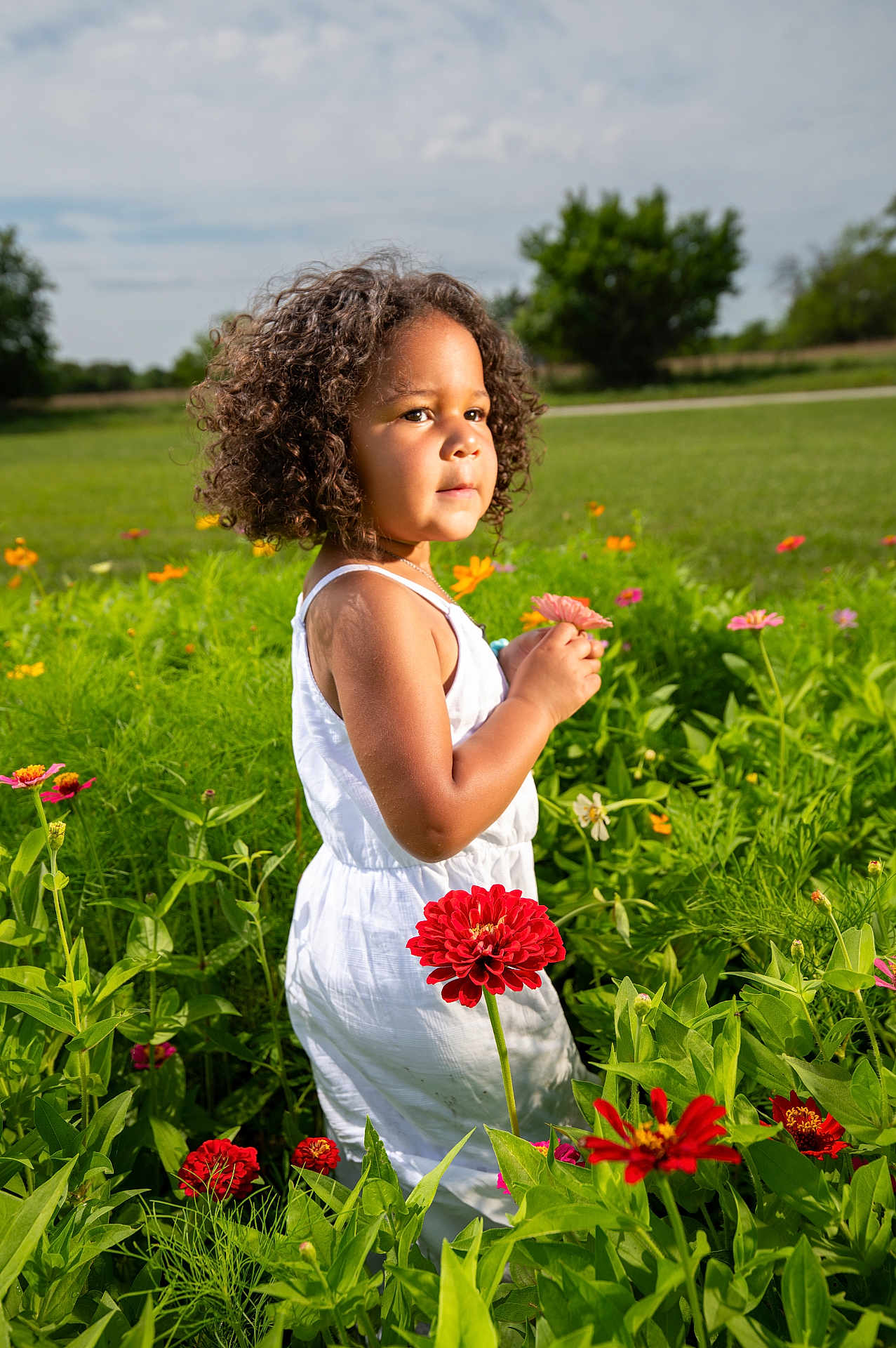 Cora-Leigh joined the competition — help win amazing prizes! bodypart, child, daisy, face, female, field, finger, flower, flowerarrangement, flowerbouquet, geranium, girl, grass, grassland, hand, head, nature, outdoors, person, plant