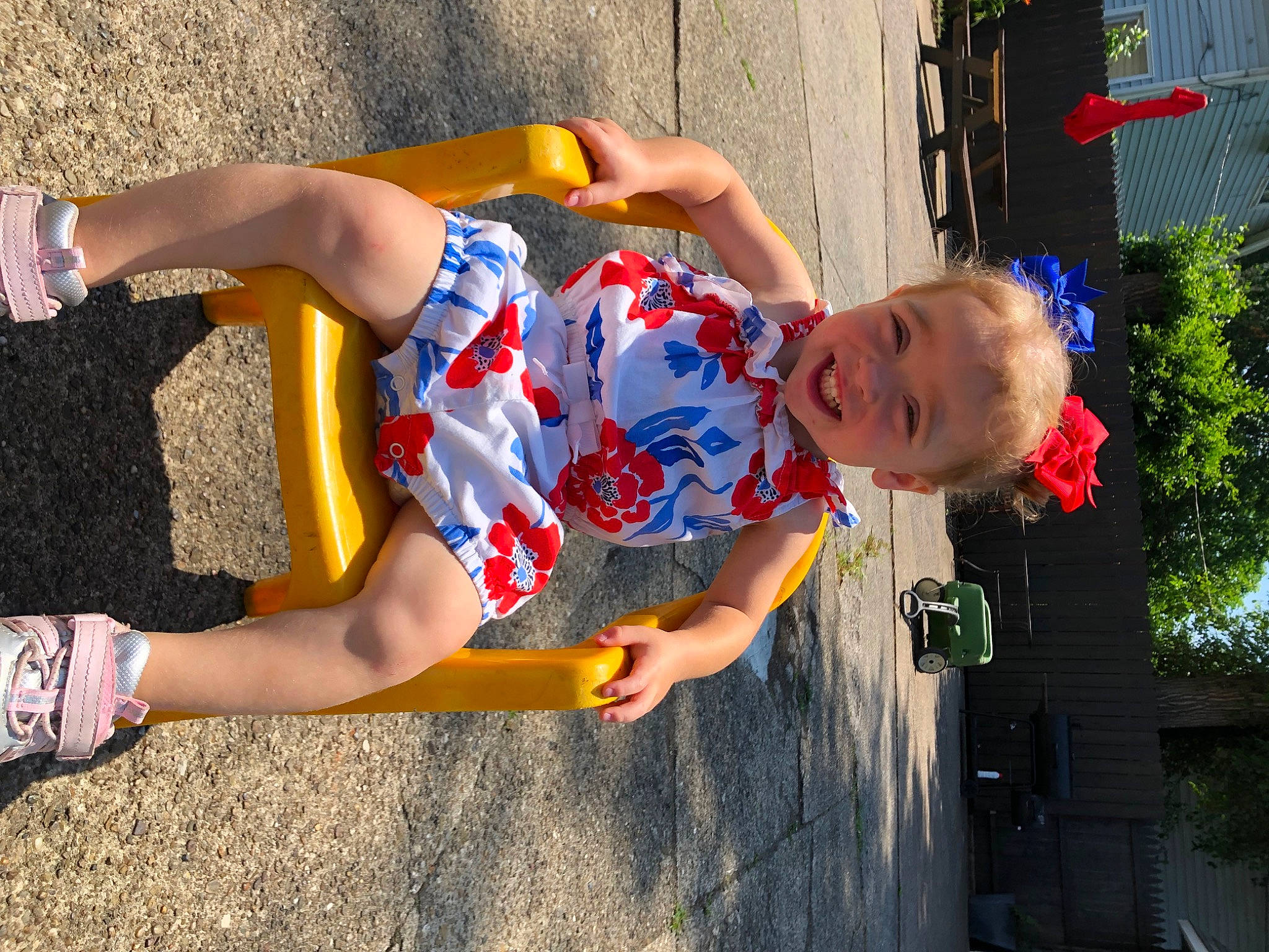 Kinley is registered to the contest to win money with this photo: blue, child, dress, electric_blue, foot, fun, grass, happy, human_leg, joy, knee, leisure, orange, person, play, recreation, red, shorts, thigh, toddler