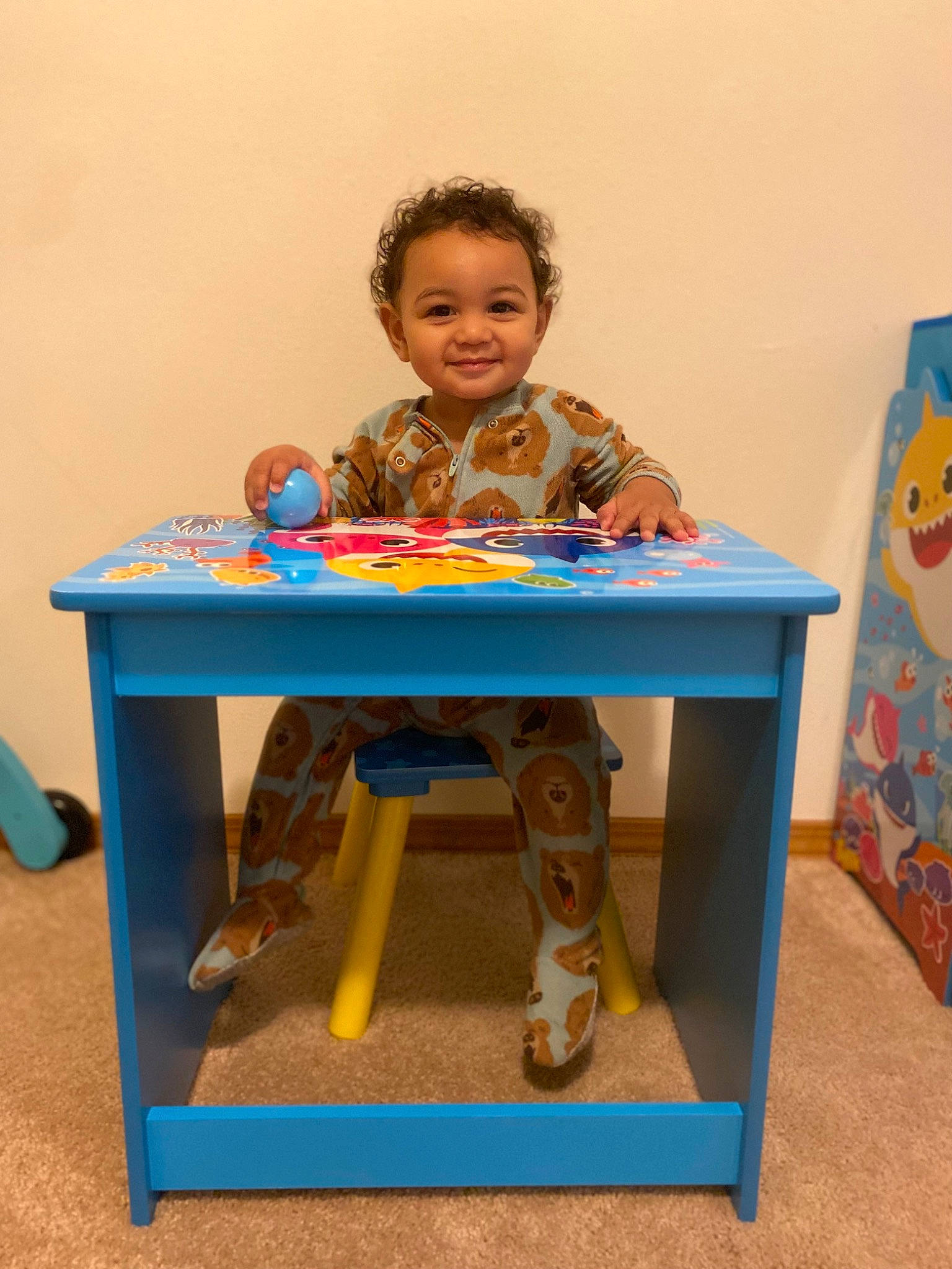 Sekani is registered to the contest to win money with this photo: chair, child, child_art, desk, electric_blue, fun, furniture, happy, joy, leisure, person, play, room, sharing, shorts, sitting, smile, t_shirt, table, tableware