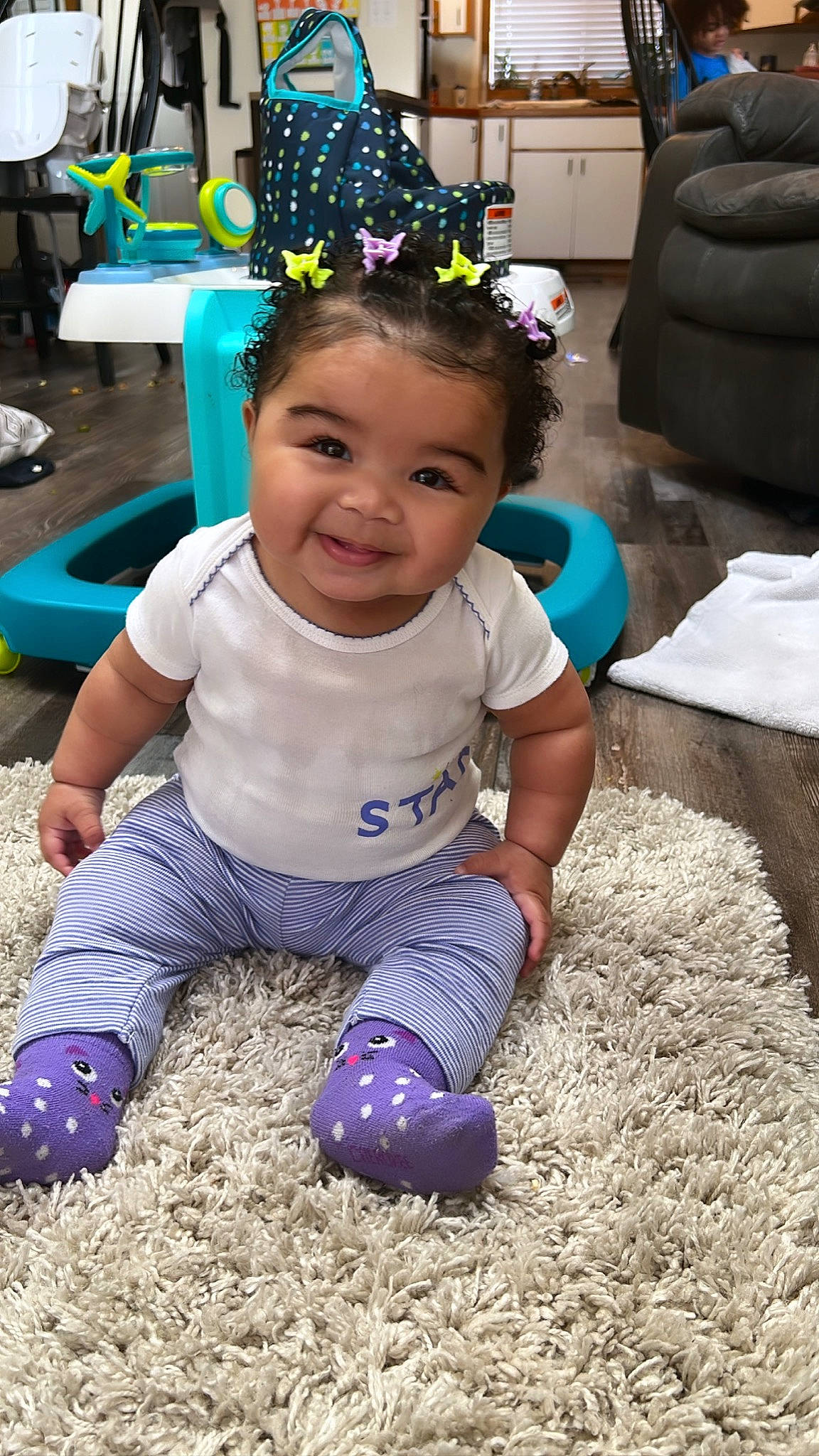 Kai is registered to the contest to win money with this photo: baby, baby_toddler_clothing, blue, chair, child, electric_blue, event, fun, grass, green, happy, joy, leisure, people, person, photograph, purple, sitting, smile, soil