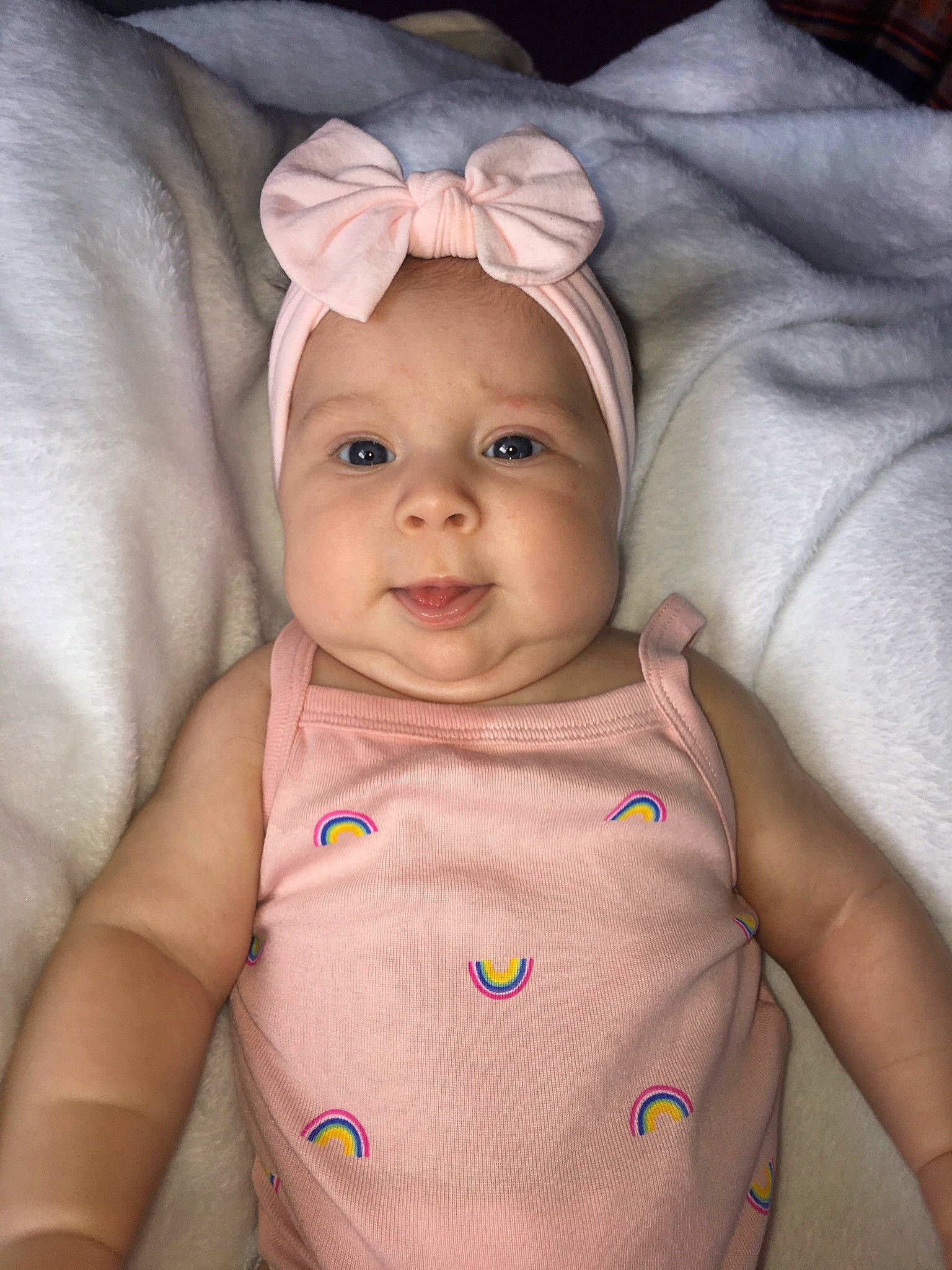 Rylah is registered to the contest to win money with this photo: baby, baby_products, blond, cheek, child, ear, eye, face, head, headwear, iris, linens, lip, organ, person, pink, product, skin, smile, toddler